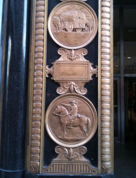 Each set of elevator doors features a relief design.
